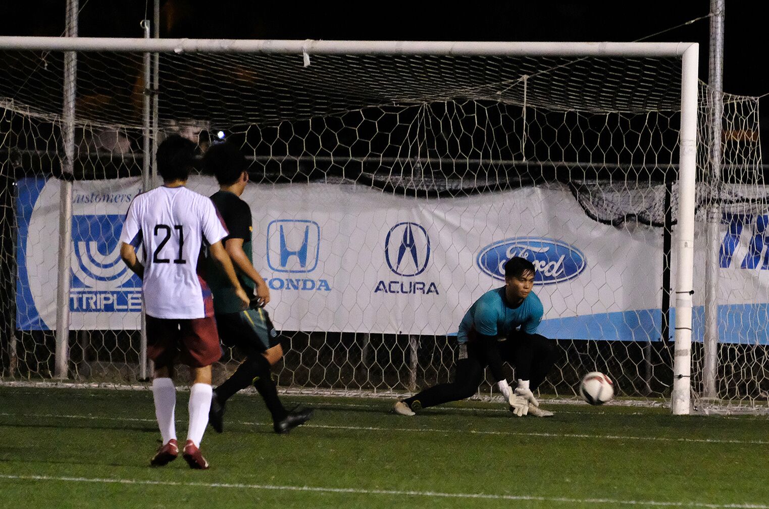 Ryoga Okada scores for the Tritons
