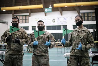 Members of the Guam National Guard at their vaccination clinic at the University of Guam Fieldhouse