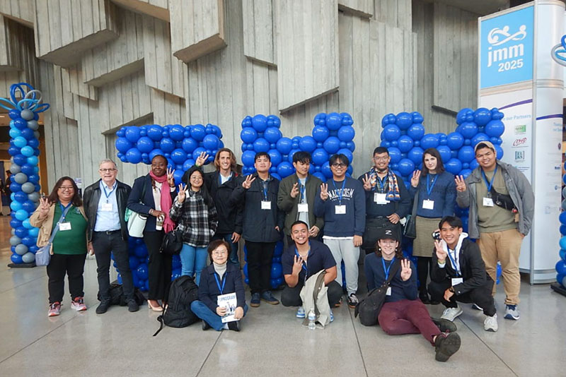 A group of students in the lobby of a conference center