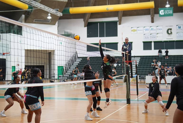 Player spikes volleyball to oponent’s side of the net