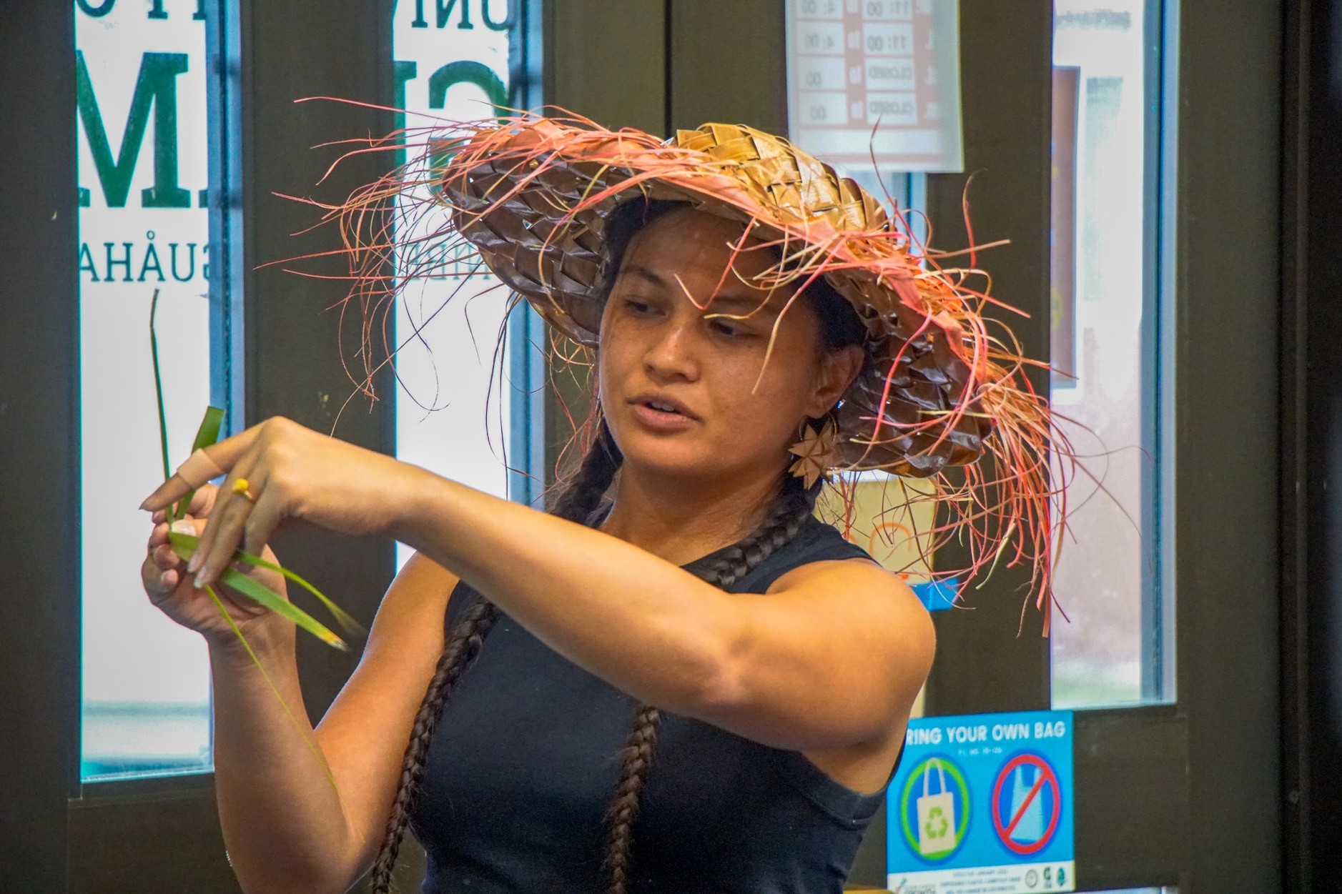 Female weaving cocunut leaves